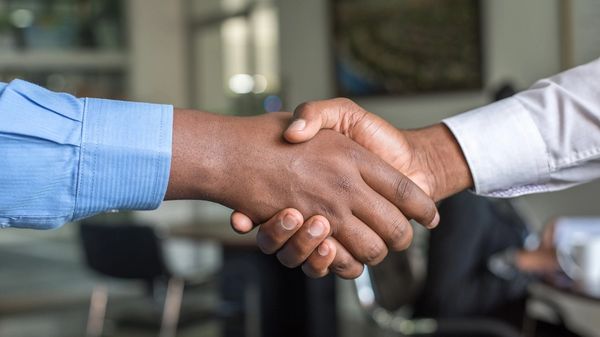 Two business partners shaking hands