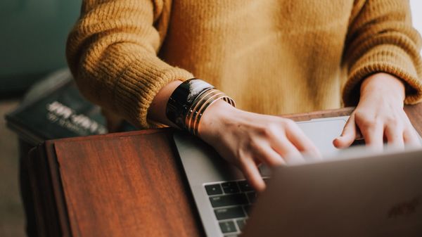 Person typing on a laptop.