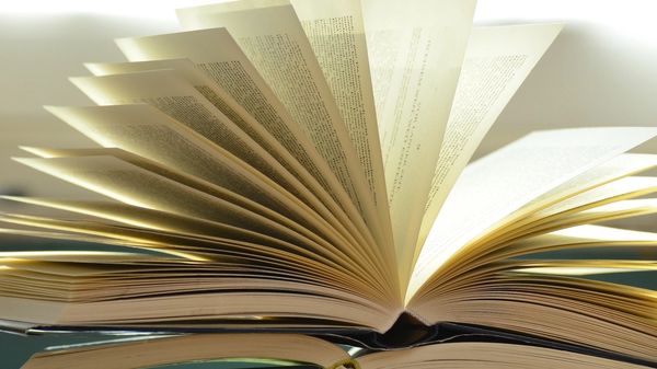 A book with pages flipping.